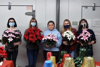 Students in the Horticulture Club hold a poinsettia sale in the Floriculture Building.